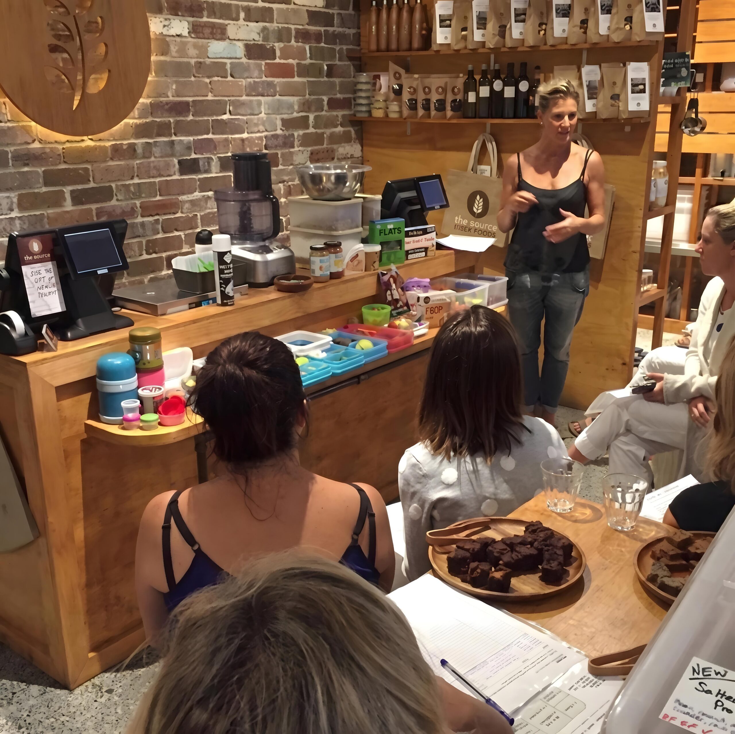 Rebekah leading a nutrition workshop at a specialty food store