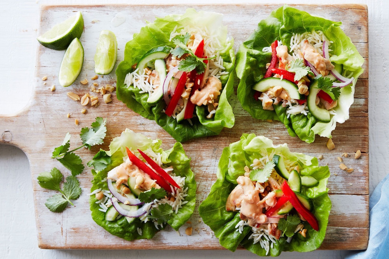 Chicken lettuce cups with rice, cucumber, capsicum, red onion and peanuts