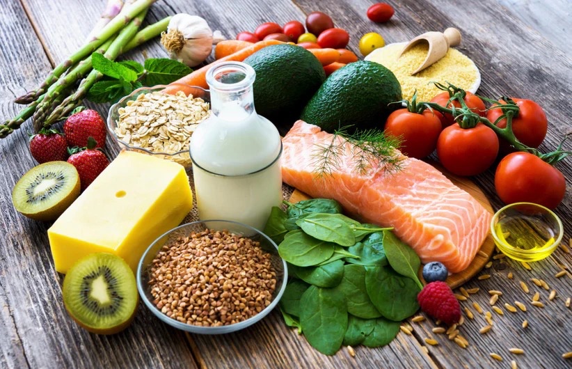 Fresh whole-food ingredients including salmon, spinach, oats and berries - the foundations of the Wholesum Plate
